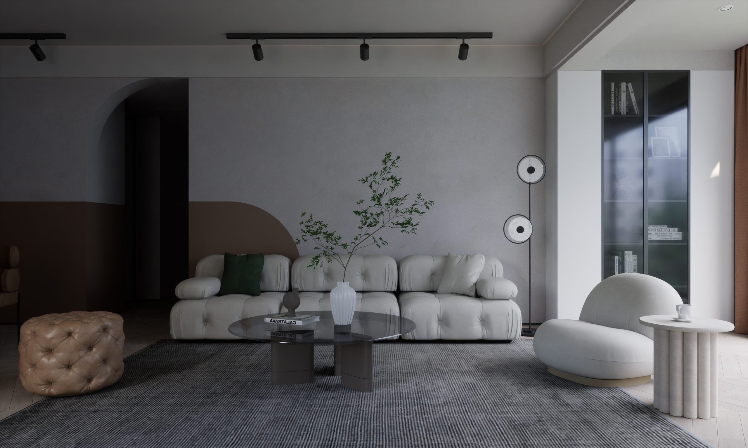 a living room with a couch, chair, table and speakers
